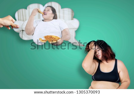 Picture of obese woman looks depressed while thinking her unhealthy habit 