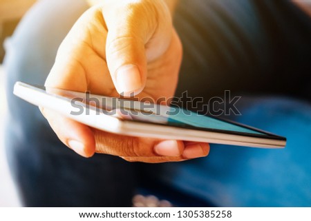 close up image of Phone on hands.