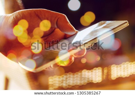 Double exposure of Phone on hands.