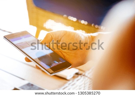 close up image of Phone on hands.