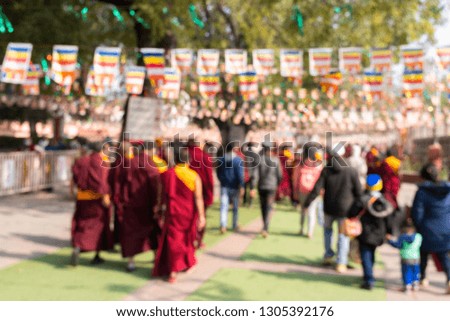 Blurred crowd Tourist and Monk walking in entrance at Mahabodhi Temple Complex in Bodh Gaya, India. 