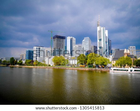 Walking along the riverbank opposite Stadel museum, Financial district in  Frankfurt GERMANY