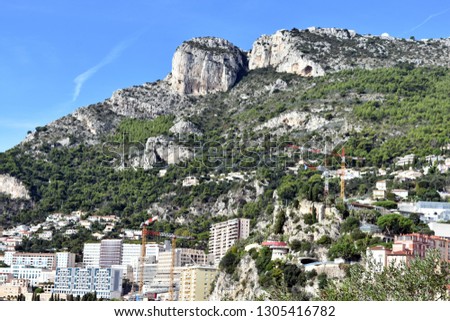    The city of Monte Carlo surrounded by the picturable cliff-faces of the area.   