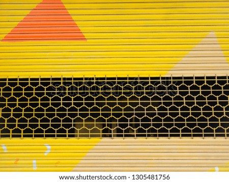 abstract of yellow painted shutter