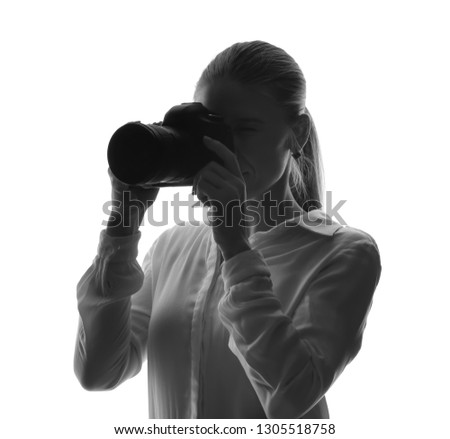 Portrait of beautiful photographer on white background