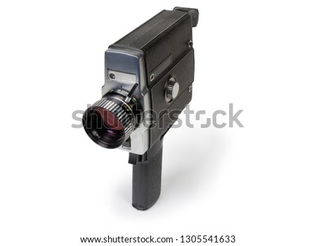 Old amateur film movie camera Super 8mm format driven by  electric motor on a white background 

