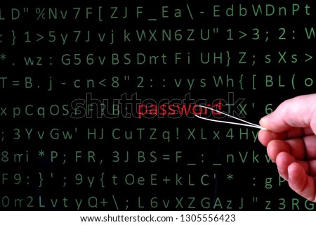 Fingers with manicure tweezers allocate on the screen of the pc monitor a string with the word password highlighting in red font among chaotic set of computer green symbols. Close up