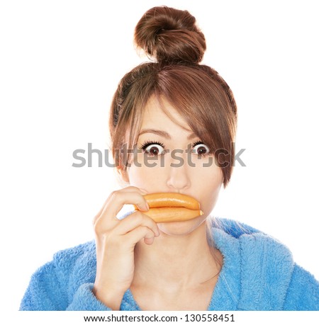 Woman with sausages simulating lip enhancement she's dreaming of filler injection
