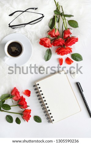 Business composition of red roses with coffee and to-do list on a white background. Female business.  Top view. Copy space.  Mock-up