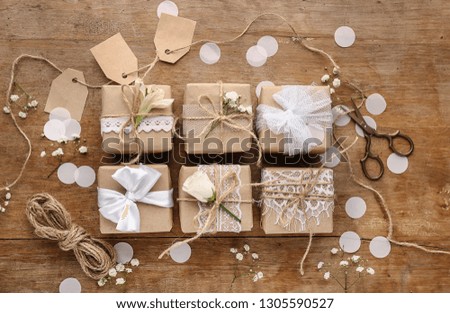 Beautiful handmade gifts on wooden background