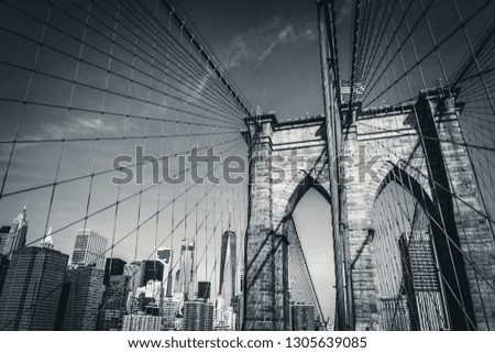 The Brooklyn Bridge in black and white with the new World Trade Center in the background, New York City, USA
