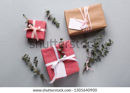 Festive gift boxes on grey table