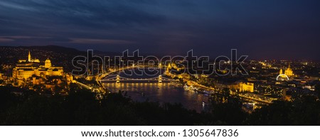 Panorama of Budapest's evening.Capital of Hungary.Beautiful big old town.The photo is made in the dark.The magnificent city is rich in history.City landscape with a wide large river. Golden city.
