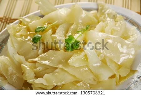 Bayrisch Kraut - Bavarian cabbage, shredded cabbage that is cooked in beef stock with pork lard, onion, apples, and seasoned with vinegar