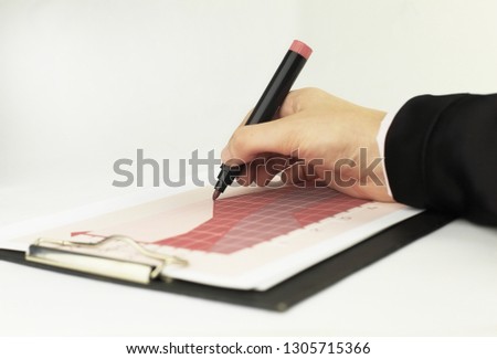 close-up. Manager checking financial schedule. isolated on white background