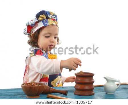 Cute toddler cooking dressed as a chef. More pictures of this baby at my gallery