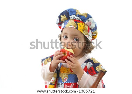 Cute toddler eating an apple dressed at a chef. More pictures of this baby at my gallery