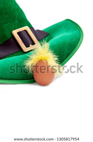 A St. Patrick's day costume hat of a leprechaun. Irish green hat on a white background with egg.