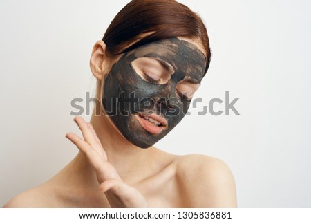woman closed eyes in a cosmetic mask portrait