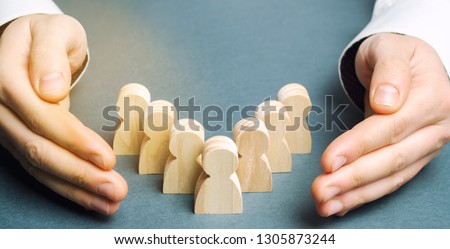 Boss defending his team with a gesture of protection. Life insurance. Customer care, care for employees. Security and safety in a business team. Human resources. A responsibility. Social protection Royalty-Free Stock Photo #1305873244