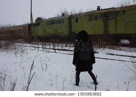 Girl near old train in Chernobyl