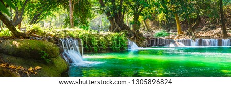 Wide panorama beautiful fresh green nature scenic landscape waterfall in deep tropical jungle rain forest, Famous landmark outdoor travel Saraburi Thailand, Spring background, Tourism destination Asia