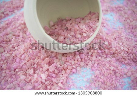 Beautiful pink sea salt for aromatherapy. Picture with a light tone. Mineral for body care. Natural cosmetics.
