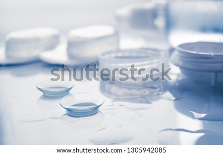 Contact lenses set with pair of contact lenses, bottle whith solution and container. Selective focus, shallow depth of field