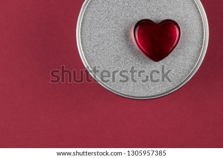 Stylish glass heart on textured metal box with Valentine gift