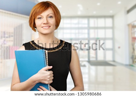 Mature businesswoman wearing formal suit on background