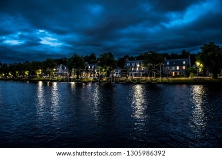 Illuminated Buildings In The Scenic Streets Of The City Of Inverness At The River Ness At Night in Scotland Royalty-Free Stock Photo #1305986392