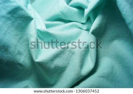 crumpled blue cloth cotton macro vignetting canvas close-up background                      