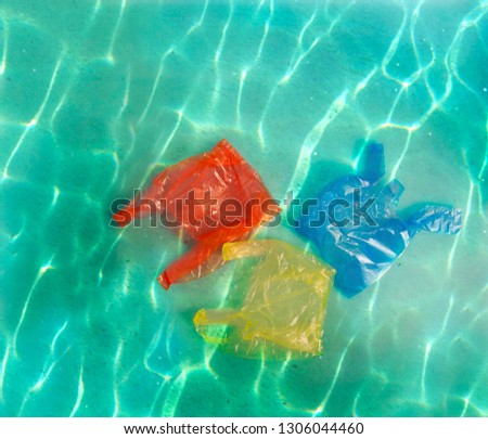  Plastic garbage (bag, bottles) in the ocean. Stop ocean pollution.Water waste problem creative concept. Eco problem banner with restrictive sign.