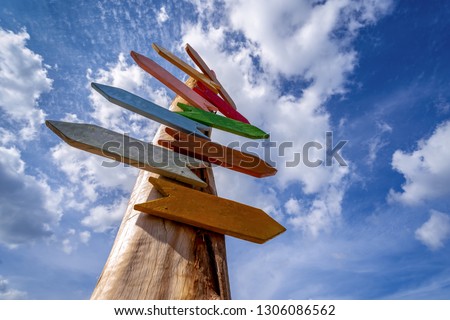 Direction Signs on blue sky, Many blank direction road sign Royalty-Free Stock Photo #1306086562
