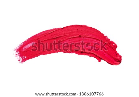 Red lipstick smear on white background, top view