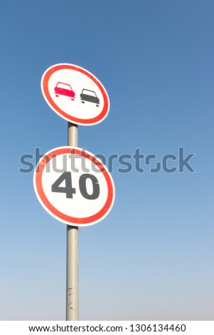 Speed limitation road sign. Overtaking prohibition road sign. Traffic sign.