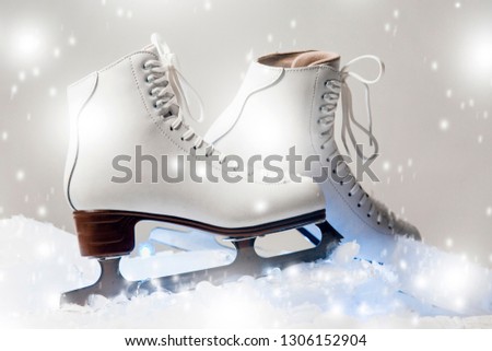 white figure skates on blocks of ice in the studio settings
