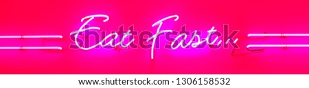Eat fast. Neon sign