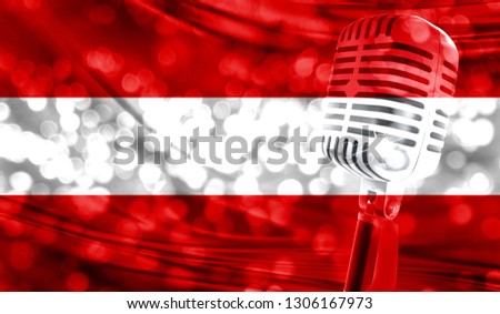 Microphone on a background of a blurry Austria flag close-up