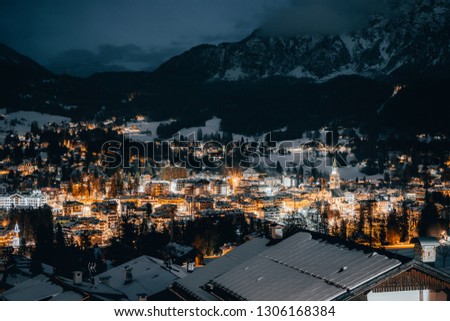Scenic view over Cortina D'Ampezzo in Dolomites, Italy. Blue hour view over Cortina in Dolomites.