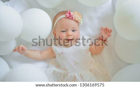 You are my little angel. Family. Child care. Childrens day. Childhood happiness. Sweet little baby. New life and birth. Small girl. Happy birthday. Portrait of happy little child in white balloons.