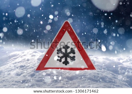 winter driving - warning sign - risk of snow and ice 