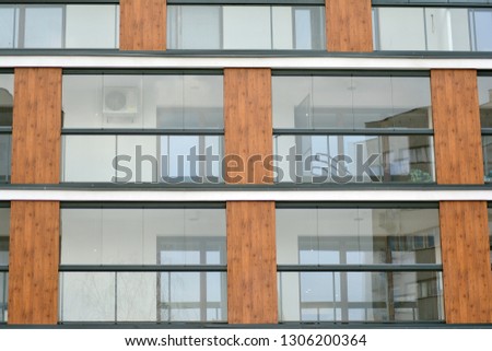 Abstract fragment of contemporary architecture, walls made of glass and concrete.