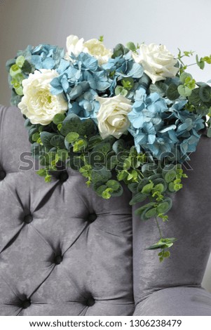 Beautiful bouquet of artificial flowers of roses, hydrangea, peonies, eucalyptus