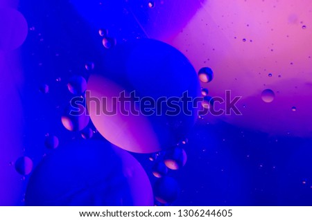 Bubbles on the water surface with neon light