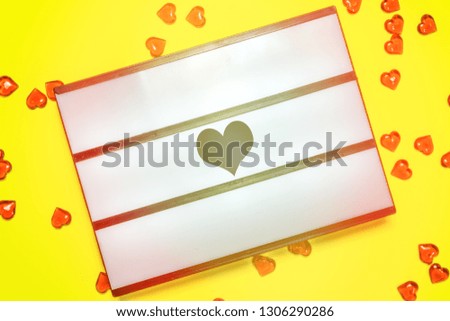 Flat lay of Lightbox on yellow  background, room for text, Valentine’s Day concept