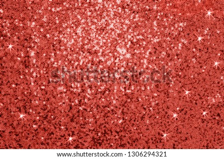 Metal glitter gold cloth background, close up. sparkling sequined textile. Living Coral Color 2019 year concept, sparkling sequined textile