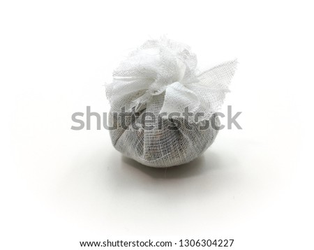 Soup Spices packed in a muslin cloth on white background.