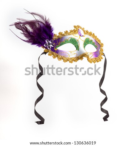 Colorful feathered Mardi Gras masquerade mask isolated on white background