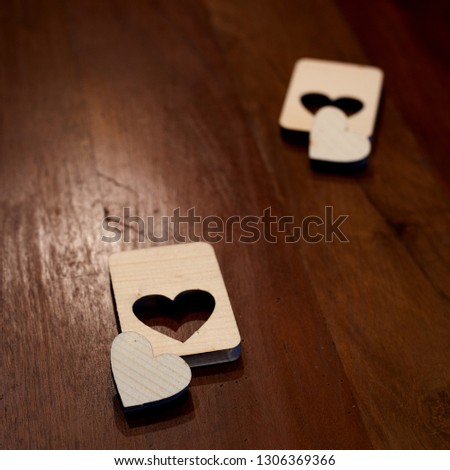 Two wooden hearts placed nicely on vintage wood background. Valentine's day